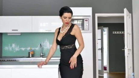 Gorgeous housewife in sexy underwear Kira Queen is masturbating pussy on the table